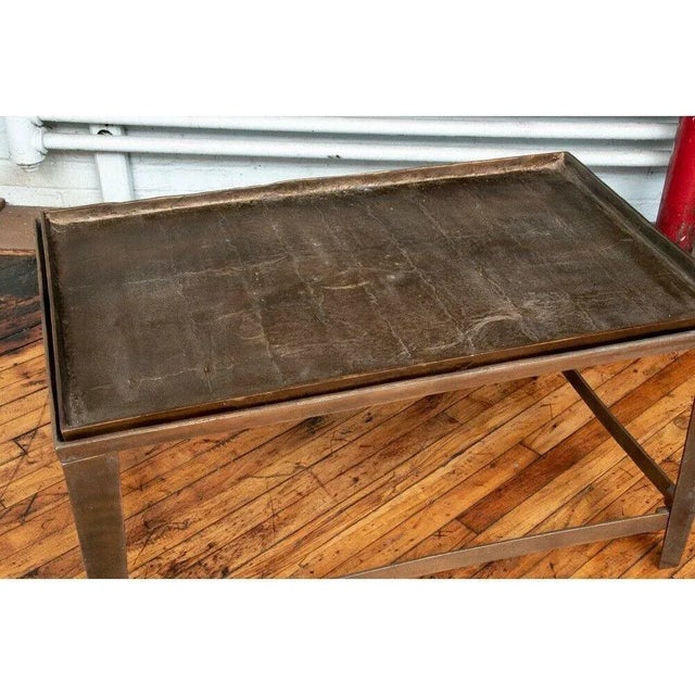 Bronze tray coffee table with a rectilinear open frame base. A heavy, bronze tray with a wonderful patinated, textured and...