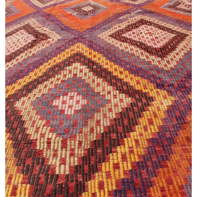 Mid 20th Century Hand Woven Vintage Turkish Embroidered Kilim Rug in Vivid Colors of Purple and Orange For Sale - Image 4 of 13