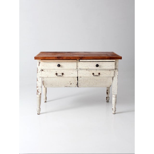 Antique American primitive baker’s table dating to the late 19th century, featuring integrated dough bins, drawers, turned...