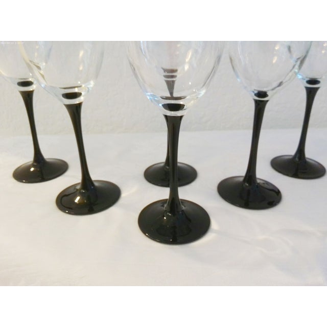 Lovely set of six vintage crystal black stemmed wine glasses with long stems. Each glass holds 6 oz. Excellent condition....