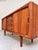 This sideboard by H.P. Hansen is an absolute gem of Danish furniture craftsmanship, embodying the artisanal perfection of...