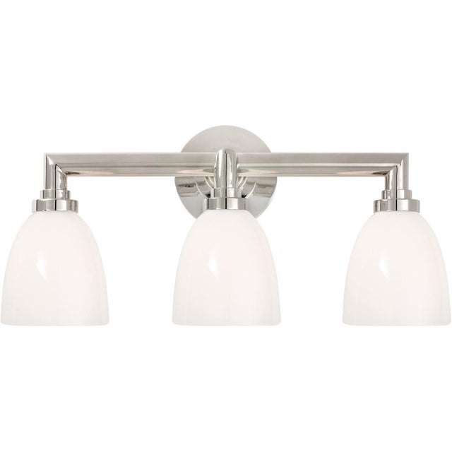 Wilton Triple Bath Light in Polished Nickel with White Glass Designer: Chapman & Myers Height: 10.5" Extension: 8.75"...