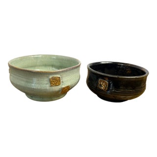Gary Eagan Spring Street Pottery Complementary Bowl Pair — Celadon & Tenmoku With Applied Gold Seals For Sale
