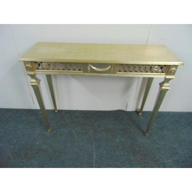 Italian Florentine console table, silver gilt finish , pierced carved skirt, tapered legs