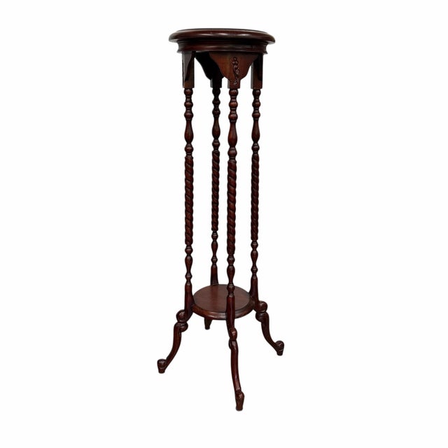 Offering this vintage barley twist pedestal plant stand, a classic piece of furniture crafted in a traditional Victorian...