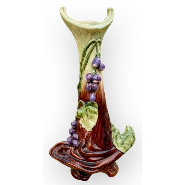 Large majolica Art Nouveau Bohemia vase in lovely shades of brown, plum and leaf green. Foliage and plum fruit decoration...
