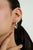 These contemporary hoop earrings feature 0.98 carats of natural emeralds set in 14K yellow gold. The emerald measuring 6 x...