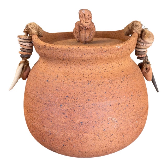 1970s Handmade Indonesian Terracotta Lidded Jar With Beaded Raffia Accents and Seated Figure Finial For Sale