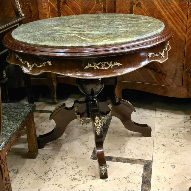 Bring timeless French elegance into your home with this exquisite Louis XVI-inspired round side table. Crafted from...