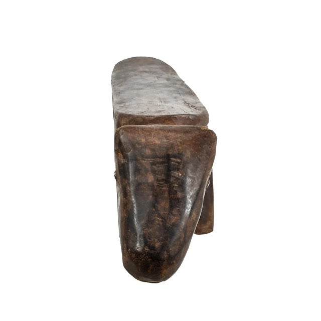 A short, stylized wood headrest made by the Dinka people of Central Africa. Could be used as a small plant stand or just...