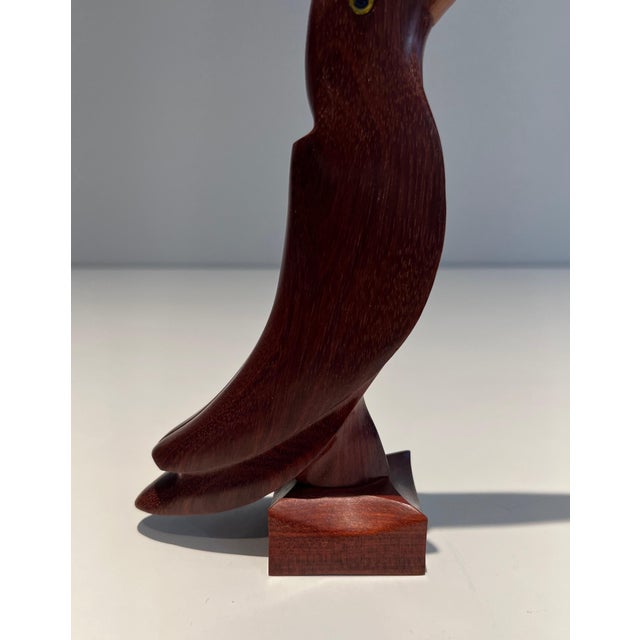 This sculpture representing a toucan is made of exotic wood with glass eyes. It is probably a French work. Circa 1970