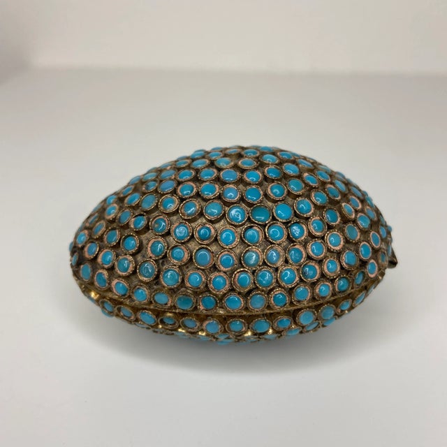 This exquisite Tibetan gau (also spelled ghau) prayer box is richly adorned with dozens of turquoise colored cabochons...