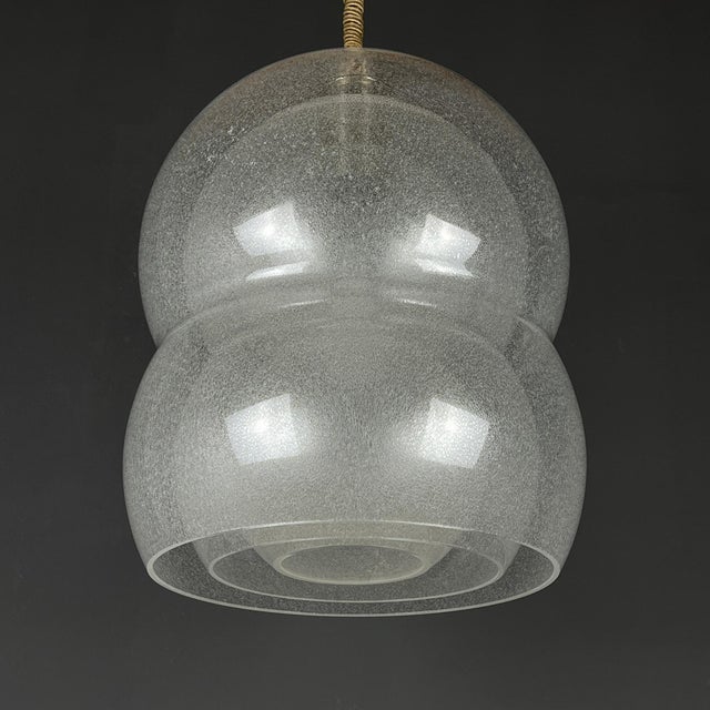 Presenting an undeniably elegant and exceptional work of artistry, a Murano glass lamp. This lamp stands as a truly rare...