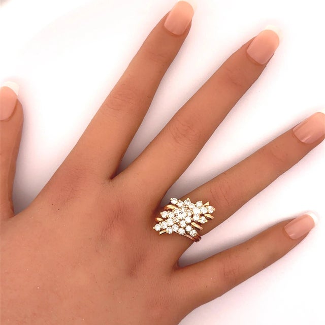 A striking cocktail ring featuring a dazzling array of round-cut diamonds, totaling 3.00 carats. The diamonds, exhibiting...