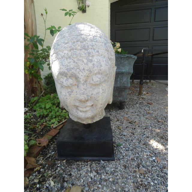 A large scale Budda head on a custom made steel base from the 19th century or possibly earlier.