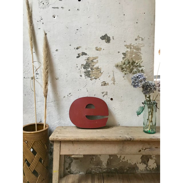 This old industrial letter 'e' in metal was produced around 1950.