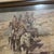 A compelling vintage Western art print capturing a dramatic historical narrative of Native American warriors traversing a...
