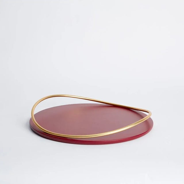 The round or oval shape of the base connects with the thin tubular forms, creating a feeling of a perpetual wave motion,...