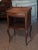 End 19th century petite walnut side table. Top with gallery over a bowed drawer and shelf. Heart cut out of each side. The...