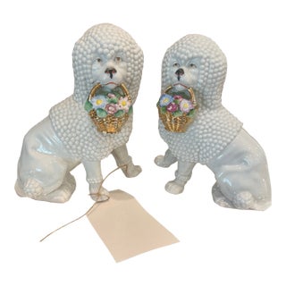 Vintage German Porcelain Spaghetti Poodle Figurines With Floral Baskets - A Pair For Sale