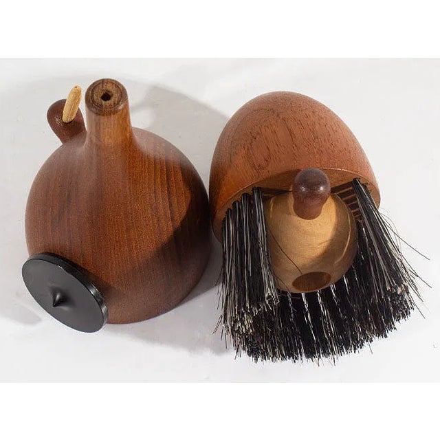 Viking-shaped teak lint brush designed by silversmith and designer Kay Bojesen (Danish; 1886-1958) for Laurids Lonbørg....