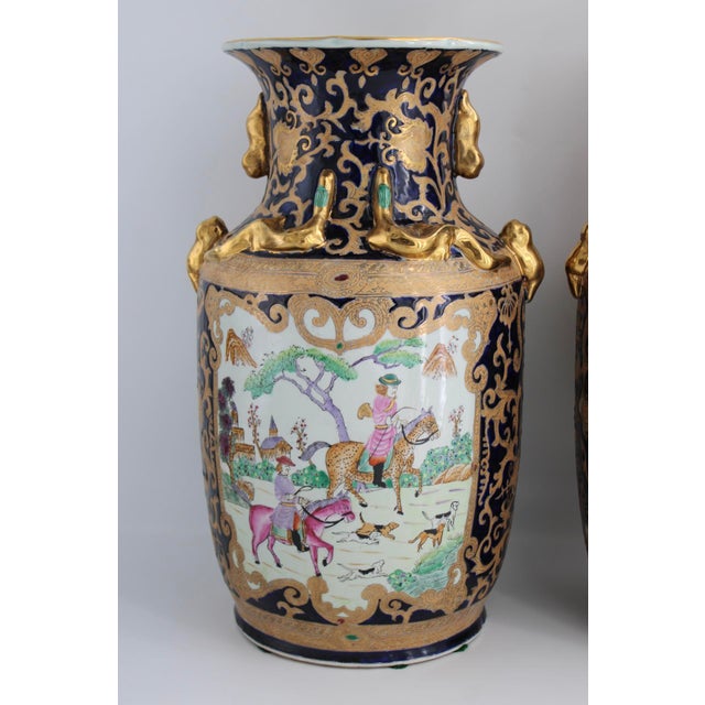 Striking matching pair of mid-century Chinese baluster vases standing an impressive 18” tall! These feature a deep cobalt...