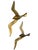 Striking vintage pair of sculptural brass seagulls by Penco, featuring sleek, abstract silhouettes captured in flight. The...