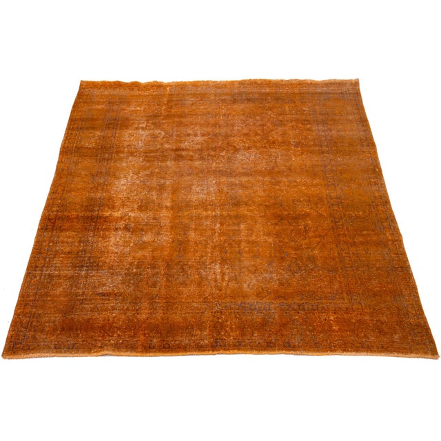 This antique, hand-knotted Persian wool rug features a medallion and floral design with brown and beige accents. This rug...