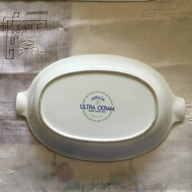 Mikasa. Oval 12.25” x 9” aprox. Freezer to Oven. Dishwasher safe.