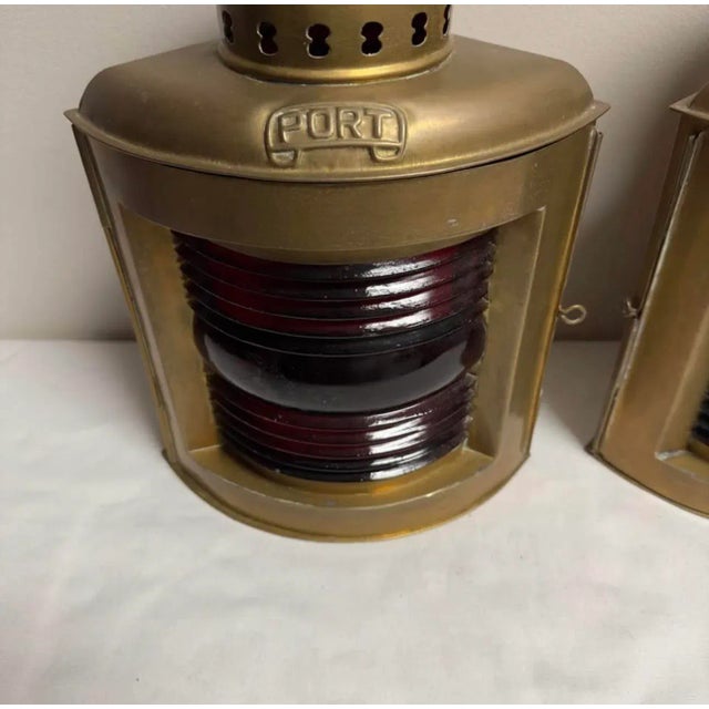 A pair of Brass nautical ship port and starboard decorative lanterns with red and green glass lenses. No damage, about...