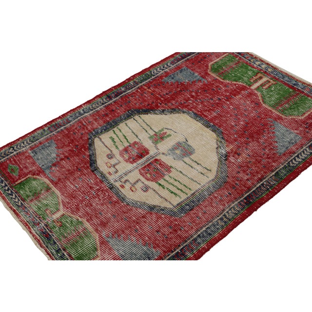 Hand-knotted in wool, circa 1950-1960, this 3’X4’ vintage Oushak tribal rug with large-scale geometric patterns is an...