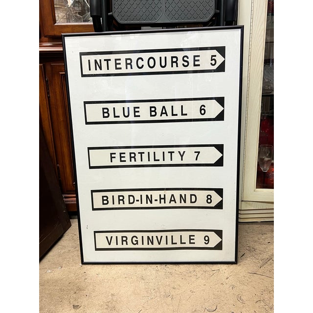 Add a touch of cheeky, graphic Americana to your gallery wall with this framed novelty road sign print. Featuring clean,...