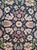 This elegant hand-knotted runner rug was woven during the mid-20th century and features a refined all-over floral design...