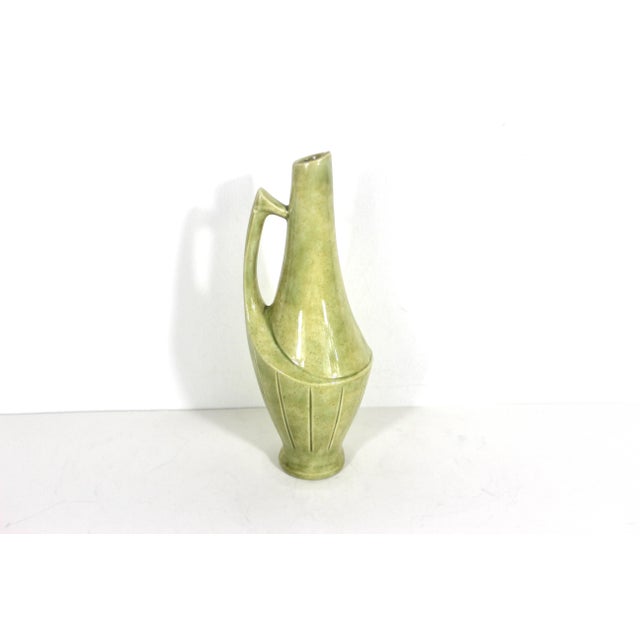 This is an Art Deco style ceramic creamer or pitcher or vase with handle. Signed on the bottom: CF 9” tall 3” wide to...