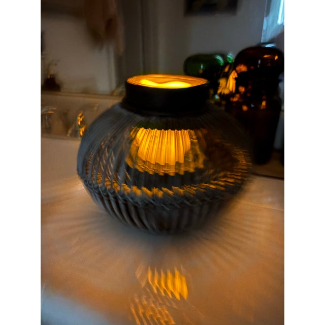 This rustic vessel has so many uses. It’s beautiful as a candle lantern or as a vase as there’s a cylinder glass that goes...