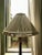 Elegant decorative floor lamp featuring a richly carved dark wood-style column with gilt accented details, ornate scroll-...