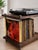 A handcrafted industrial turntable console with vinyl record storage, made from solid oak, real brass pipes, and steel...