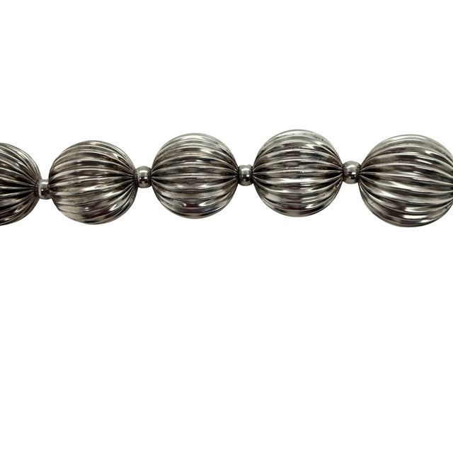 A fine vintage sterling silver necklace with large ball beads. The beads are ribbed and are strung with small &nbsp;beads...