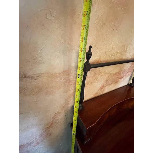Mahogany sideboard measuring 78" wide, featuring a rich polished mahogany finish with highly figured veneer, curved...