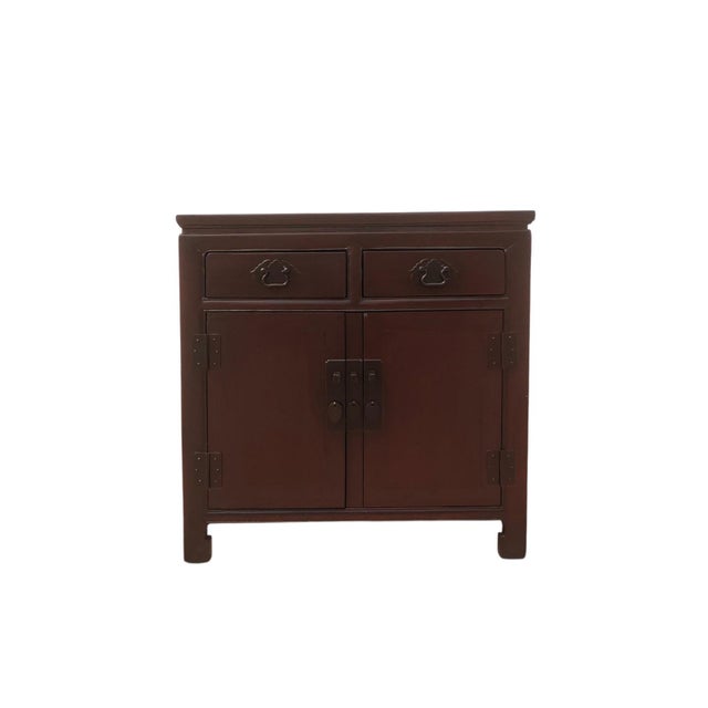 Handmade from solid elm, this antique cabinet features a clean, classic design with a rich brown finish. It offers...