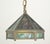 Arts & Crafts style pendant light featuring marbled green slag panels and brass framing. The chain is made of steel. This...