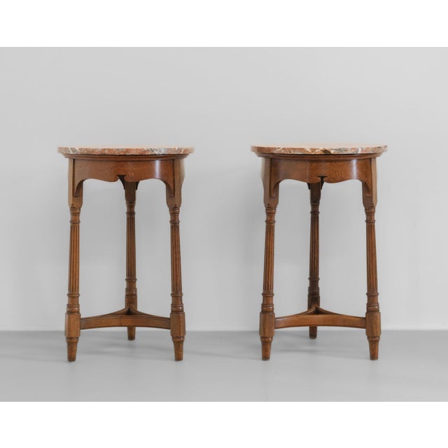 Matching pair of late 19th century gillows oak occasional side circular tables with marble tops. Each stamped: gillows...