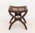 Arts and Crafts Cane-Paneled Mahogany Curule Bench, with brass nailhead details. 19.75" H x 18.25" W x 16.25" D....