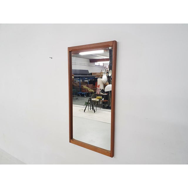 Large teak mirror in good condition. Marked on the back This piece has an attribution mark, I am sure that it is...