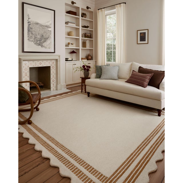 The Scottie Collection from Chris Loves Julia x Loloi is a hand-tufted wool area rug with a playful scalloped edge and...