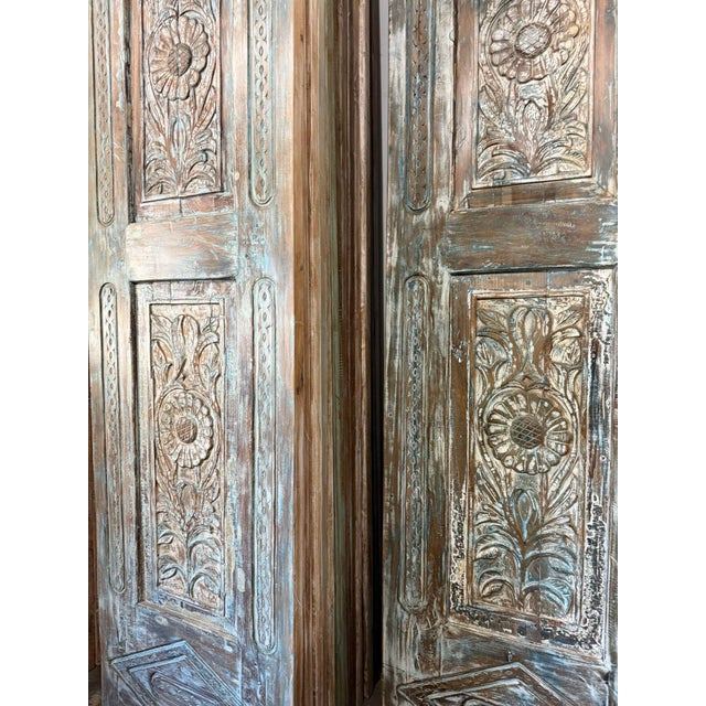Bring timeless character and artisan craftsmanship into your home with this antique carved wooden door panel finished in a...