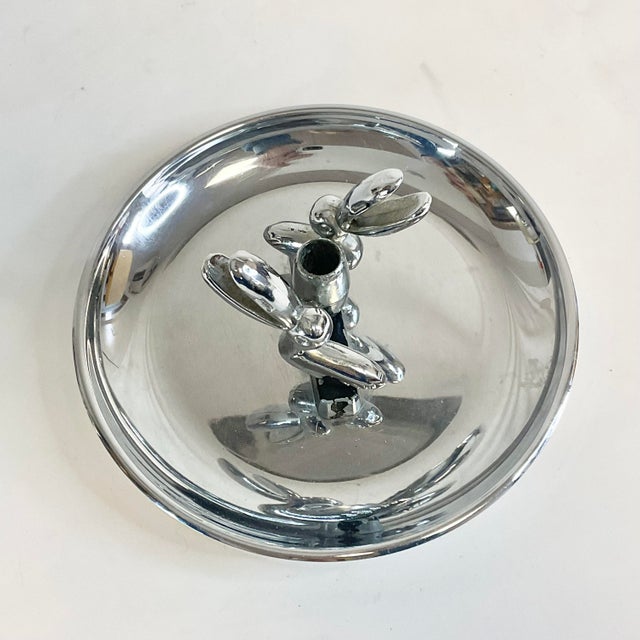 This is a Chrome finished Ashtray from the late Mid-Century. It features two large-billed ducks and the bills serve as...