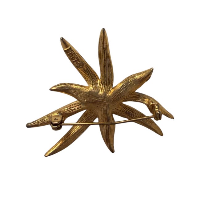 Vintage BSK gold tone flower brooch with a faux pearl and crystal accents. All original patina. Corca 1950’s.