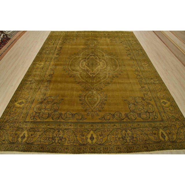 An authentic vintage traditional Overdyed Tabriz rug hand-knotted with an all-wool pile on a cotton foundation. This...