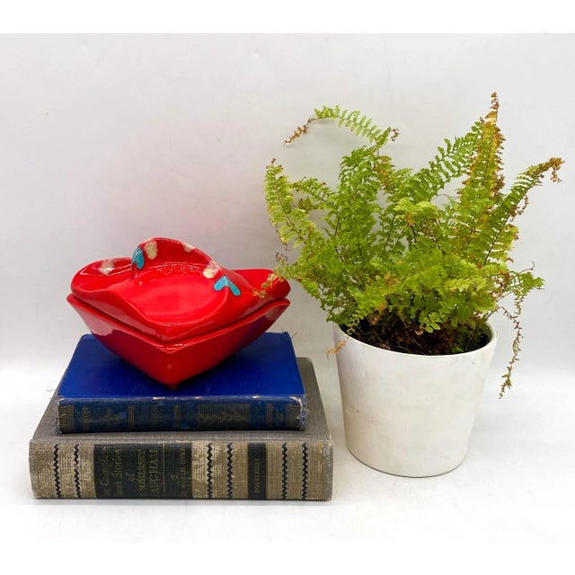 Dazzling, mid-century modern candy dish/ lidded box. The brilliant red is accented by blue and yellow spots. Features a...